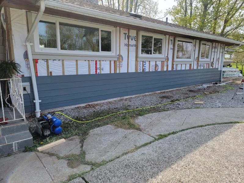 Hardie siding installation in progress